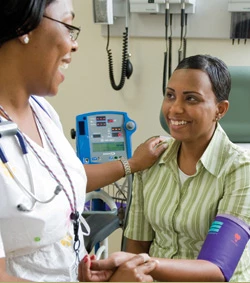 Nurse checking veteran's blood pressure